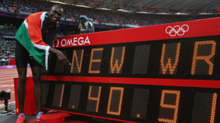 Rudisha of Kenya points to his 800m world record time