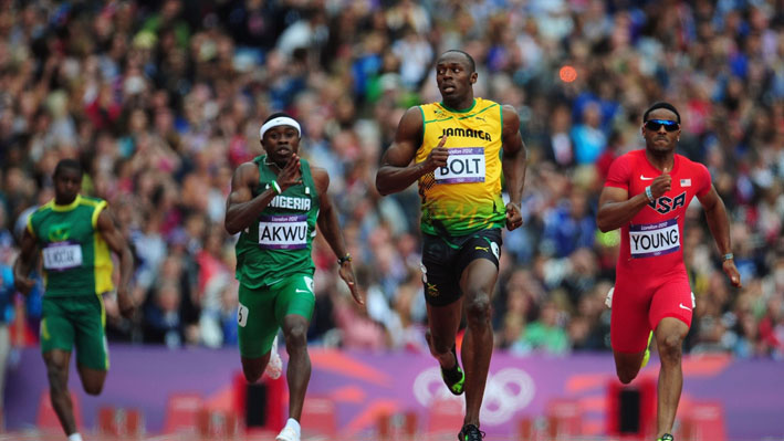 Usain Bolt of Jamaica goes in the 200m heats