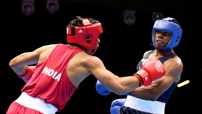 Krishan Vikas of India (L) in action with Errol Spence of USA
