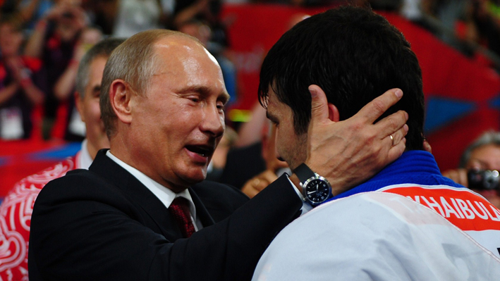 Russian President Vladimir Putin celebrates Tagir Khaibulaev