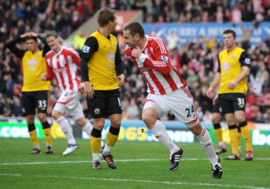Rory Delap celebrates after scoring the first goal for Stoke City