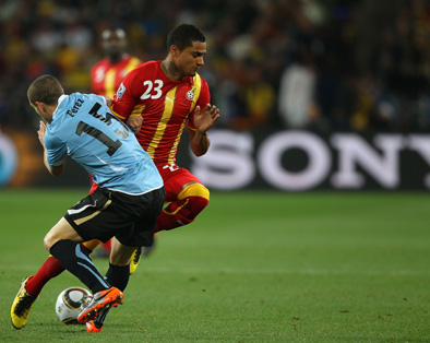 Kevin Prince Boateng of Ghana and Diego Perez of Uruguay