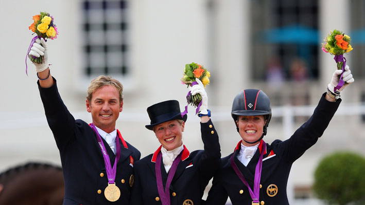 Carl Hester, Laura Bechtolsheimer and Charlotte Dujardin of Great Britain celebrate