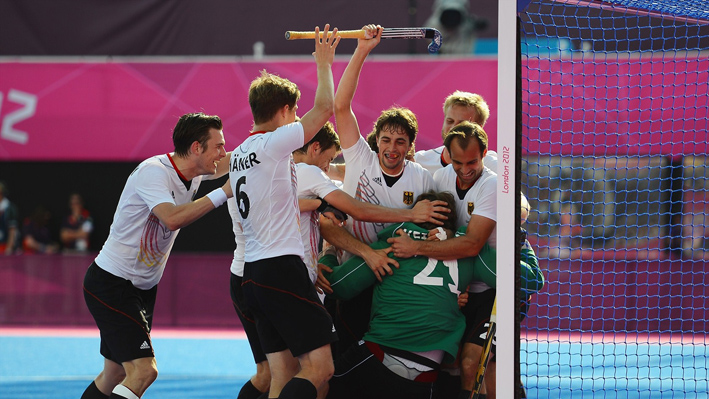 Max Weinhold of Germany and his team mates celebrate victory