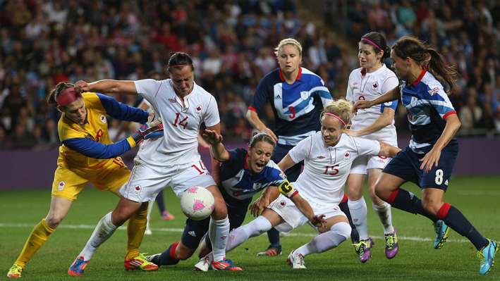 Casey Stoney of Great Britain goes down in the penalty box