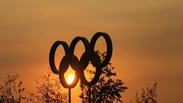Sun sets over the Olympic rings