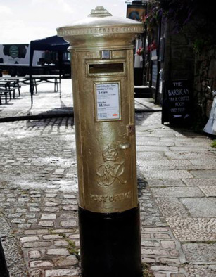 gold British mailboxes